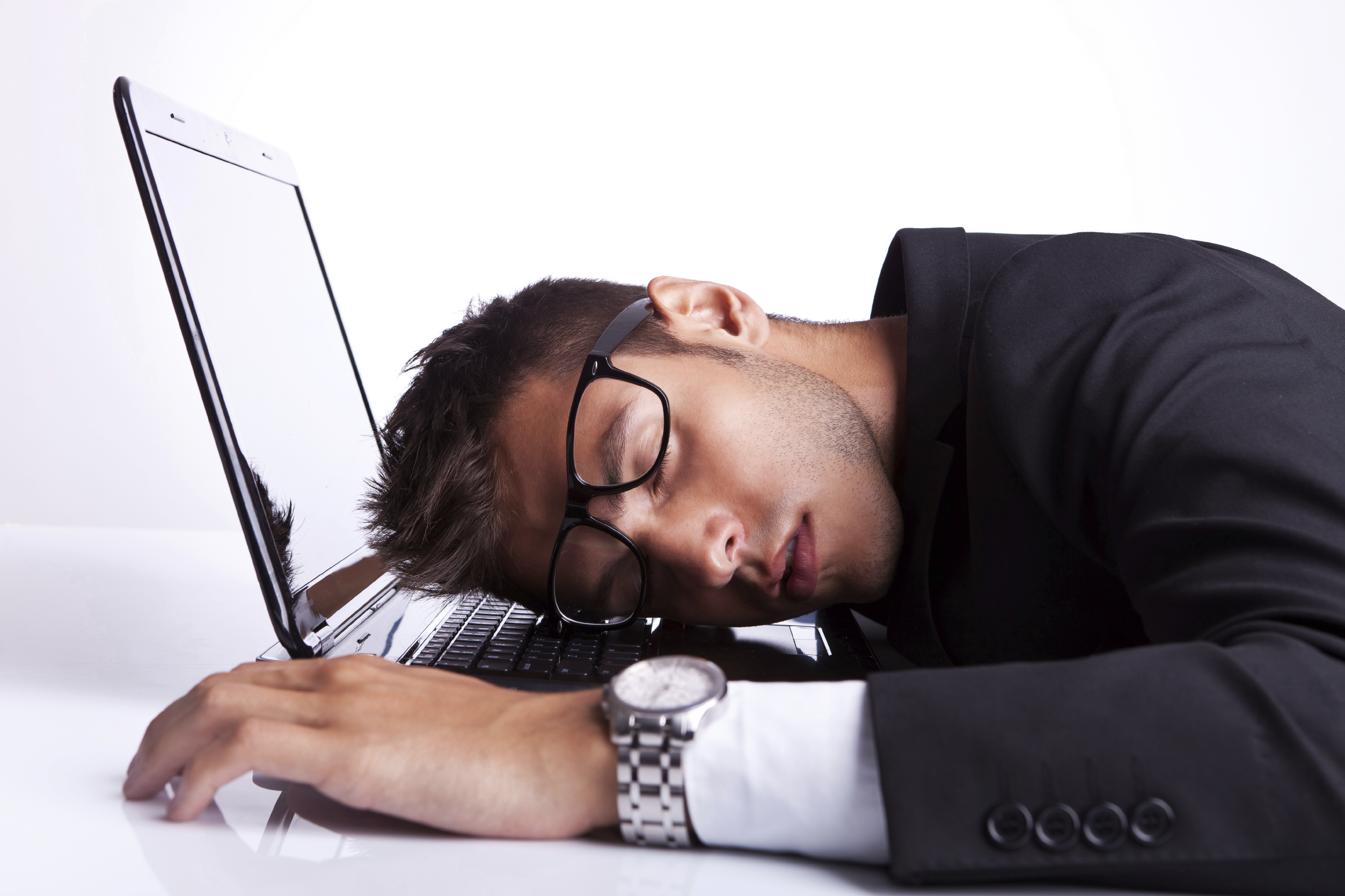 Business man sleeping on a laptop computer